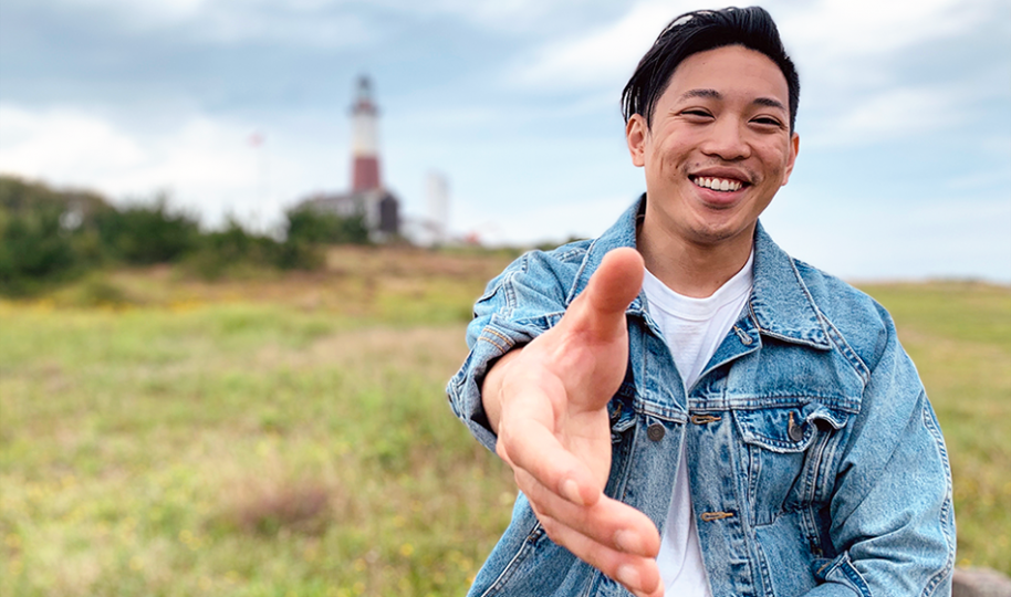 Our local guide is reaching out to greet tourist