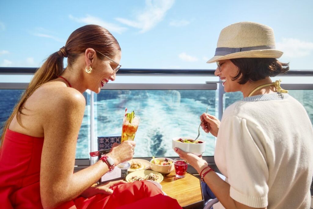 Ladies enjoying a lovely meal enjoying gorgeous panoramic ocean views