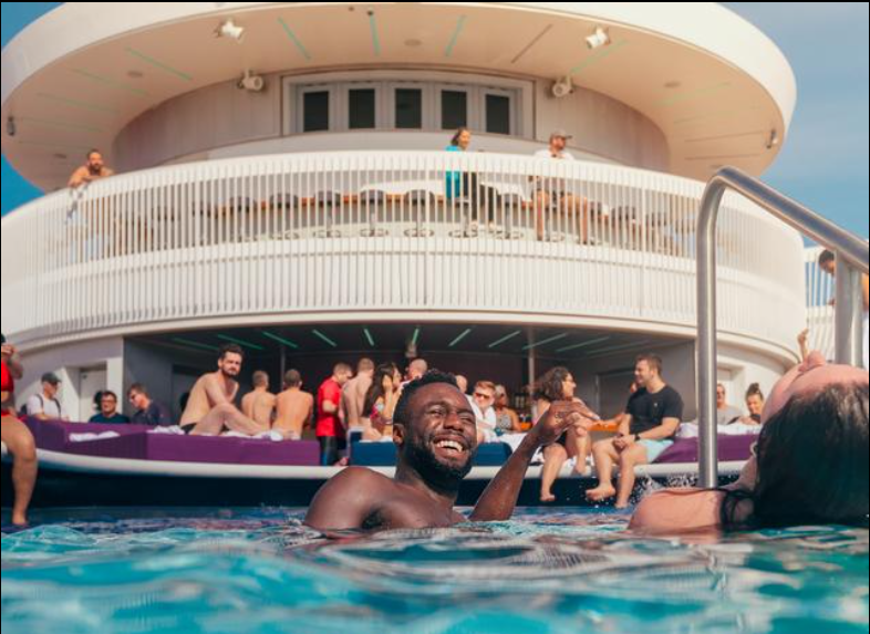 Guy enjoying the pool on board Scarlet Lady