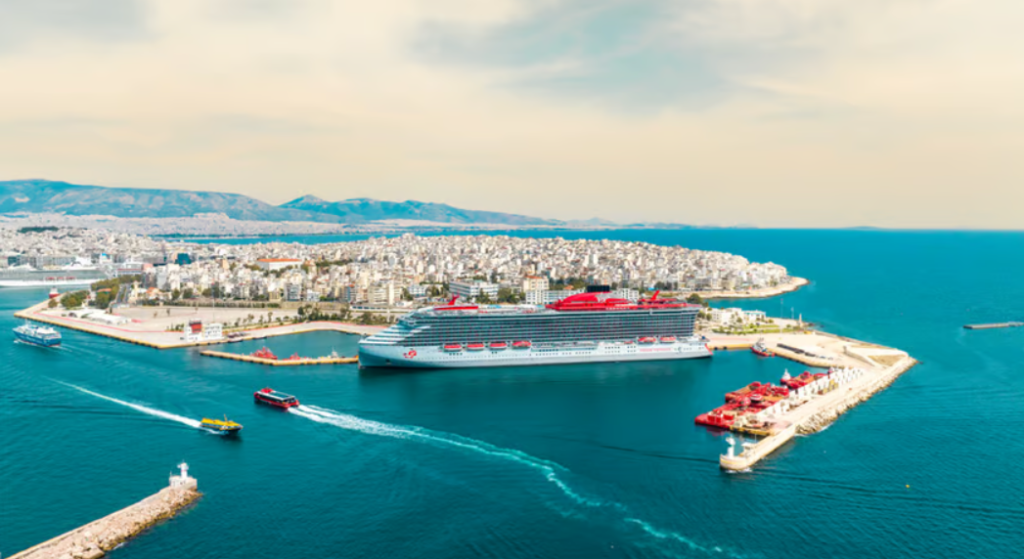 A beautiful ship at a port. Virgin Voyages Resilient Lady